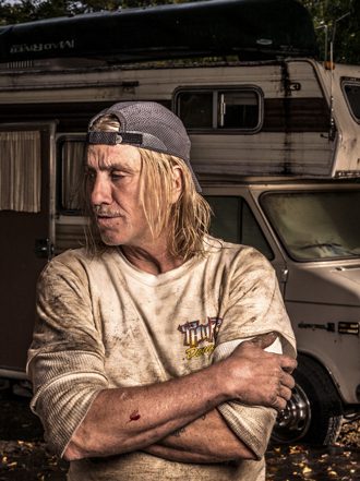 John Freeman stands before his RV in the Dallas West trailer park. He lived there for two years with his wife, D.J.: Danny Fulgencio