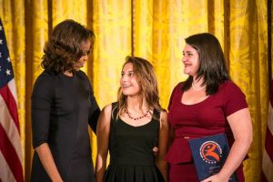 First Lady Michelle Obama, Adamson HIgh School student Emily Sanchez and Project Discovery teacher Rachel Hull