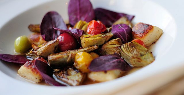 Goat cheese gnocchi with baby artichokes and heirloom red spinach: Photos by Elliott Muñoz