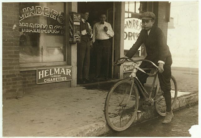 A delivery boy straddles his bike in downtown Dallas in the 1930s. Photo courtesy of the Library of Congress