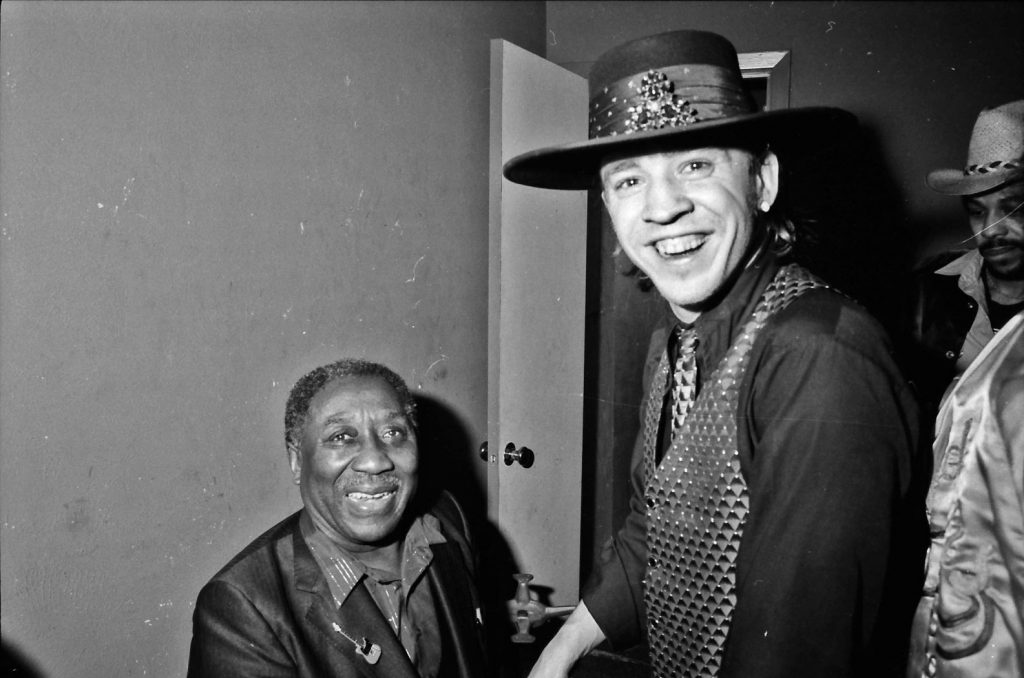 Stevie Ray Vaughan and Muddy Waters backstage at Nick's Upstairs. Photo by Kirby Warnock