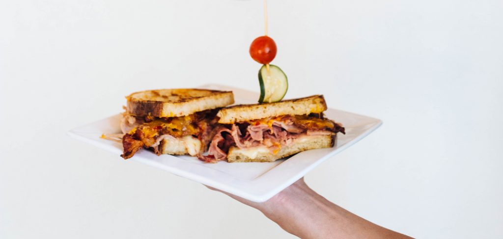 The spicy two-pork and cheese sandwich has ham, bacon, cheddar and spicy jam. Photo by Kathy Tran