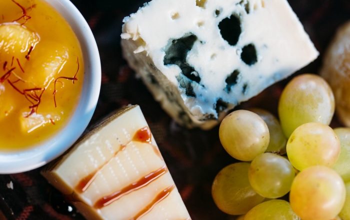 Bouchon 1314 ​Artisanal Cheese Board ​Fruit Chutney, Nuts, Grapes, Toasted Country Baguette