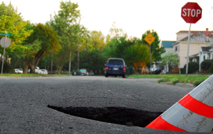 pothole with caution cone Getty