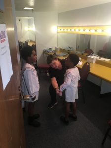 James Hayes, 7, and Anthony Taylor, 5, are fitted for their costume as Young Coalhouse in the musical "Ragtime." (Photo courtesy of Dallas Summer Musicals)