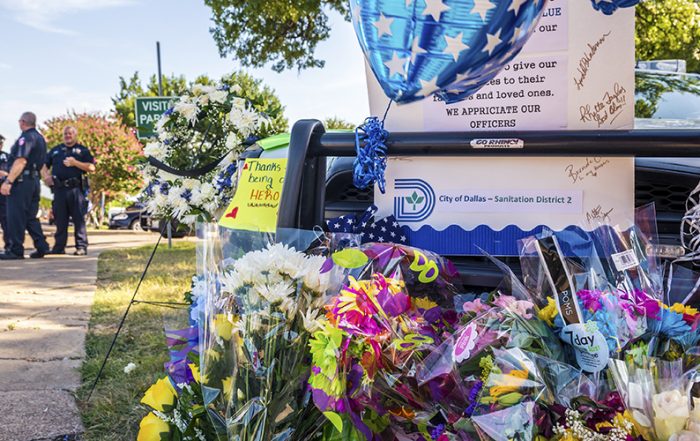 Three of the five officers killed in sniper fire Downtown on July 7 were stationed at the Dallas Police Department’s Southwest Division, which serves Oak Cliff. They are Lorne Ahrens, Michael Krol and Patrick Zamarripa. Three of the seven wounded, Gretchen Rocha, Ivan Saldana and Jorge Barrientos, also were from the Southwest Division. The division’s headquarters on West Illinois received piles of flowers, cards and other shows of support in the days after the shooting. (Photo by Danny Fulgencio)