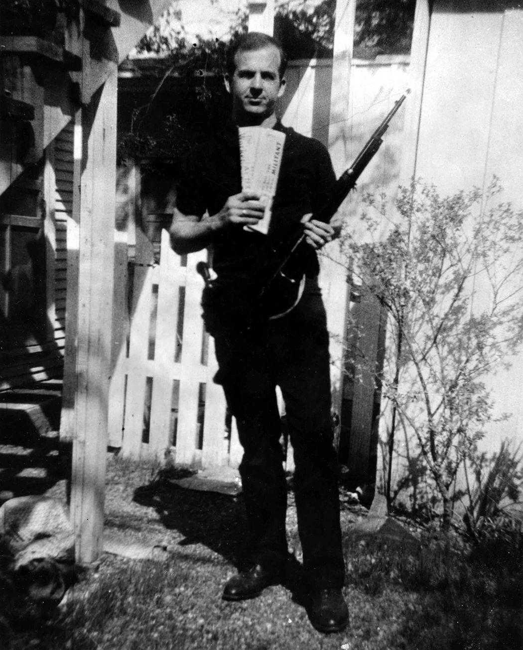 Lee Harvey Oswald in the backyard of 214 W. Neely, the duplex where he lived with wife, Marina, who took the infamous photo.(Photos courtesy of the Texas Panhandle Plains Museum, the Dallas PUblic Library and the Dallas Municipal archives)