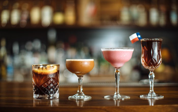 A lineup of artfully crafted cocktails: One of these nights, two-lane blacktop, pink lady and Manhattan Texas. (Photo by Kathy Tran)