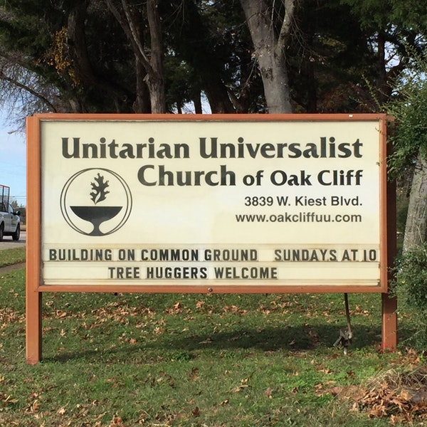 A sign that says Universal Unitarian Church of Oak Cliff. It contains the church's logo, which is a olive branch protruding from a cup.
